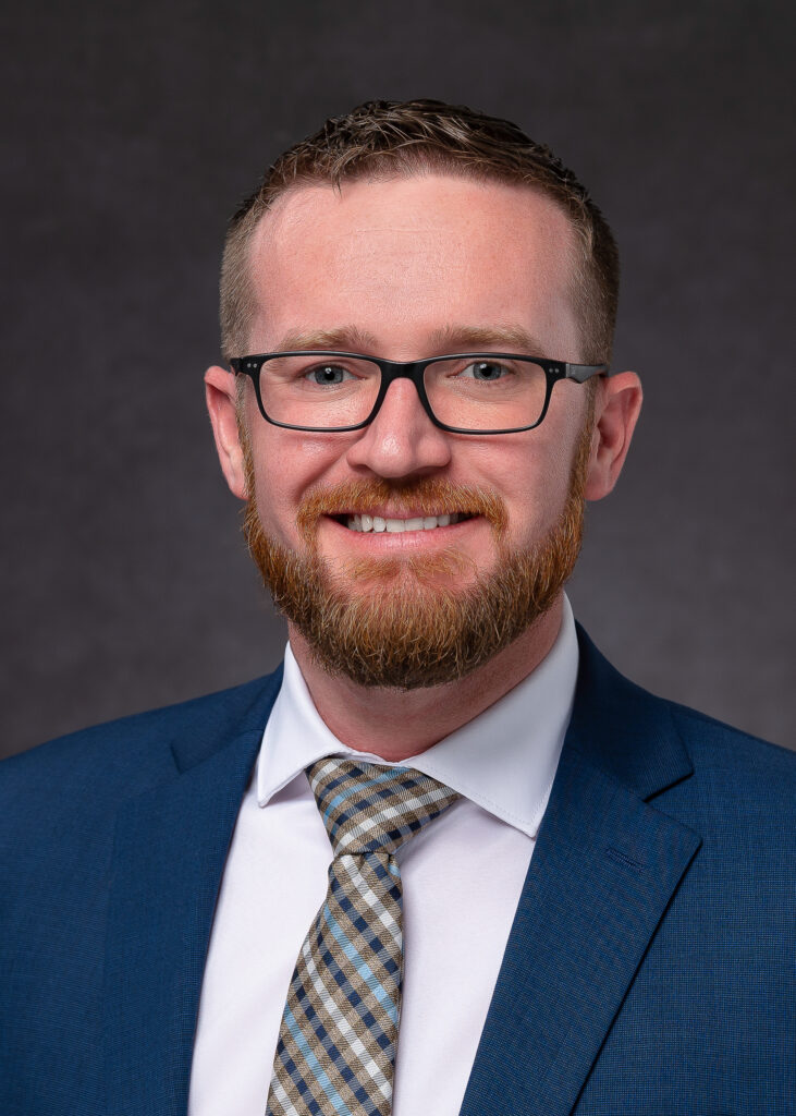 Business facility director looking at camera for professional headshots and bring photography