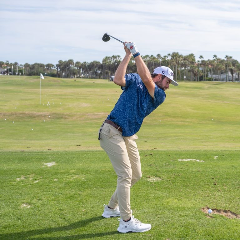 PGA Tour Golf Pro Cameron Young demonstrates a drive off the tee at the driving range in PONTE VEDRA BEACH Florida.