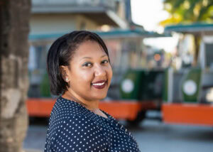 Real Estate professional looking at camera for outdoor professional headshot.