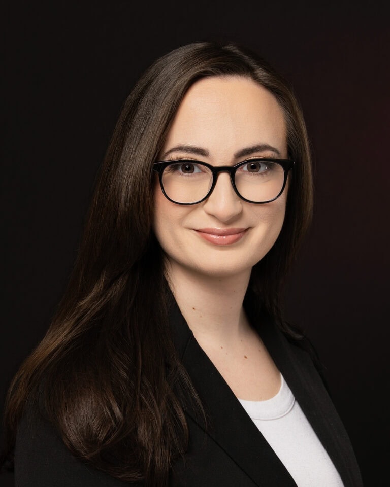 Jacksonville Branding Headshots of Rita Richa wearing black on black background.