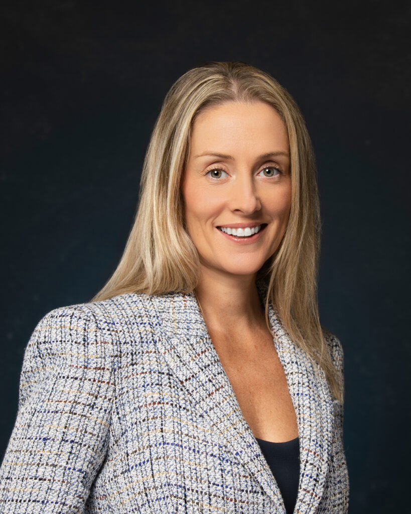 Financial Services Executive looking at camera for group headshots in jacksonville.
