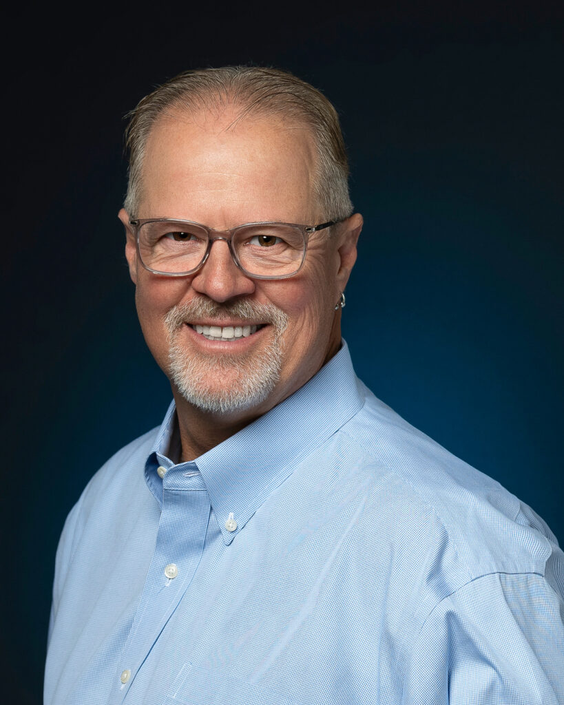 Consultant looking at camera for LinkedIN Professional headshot