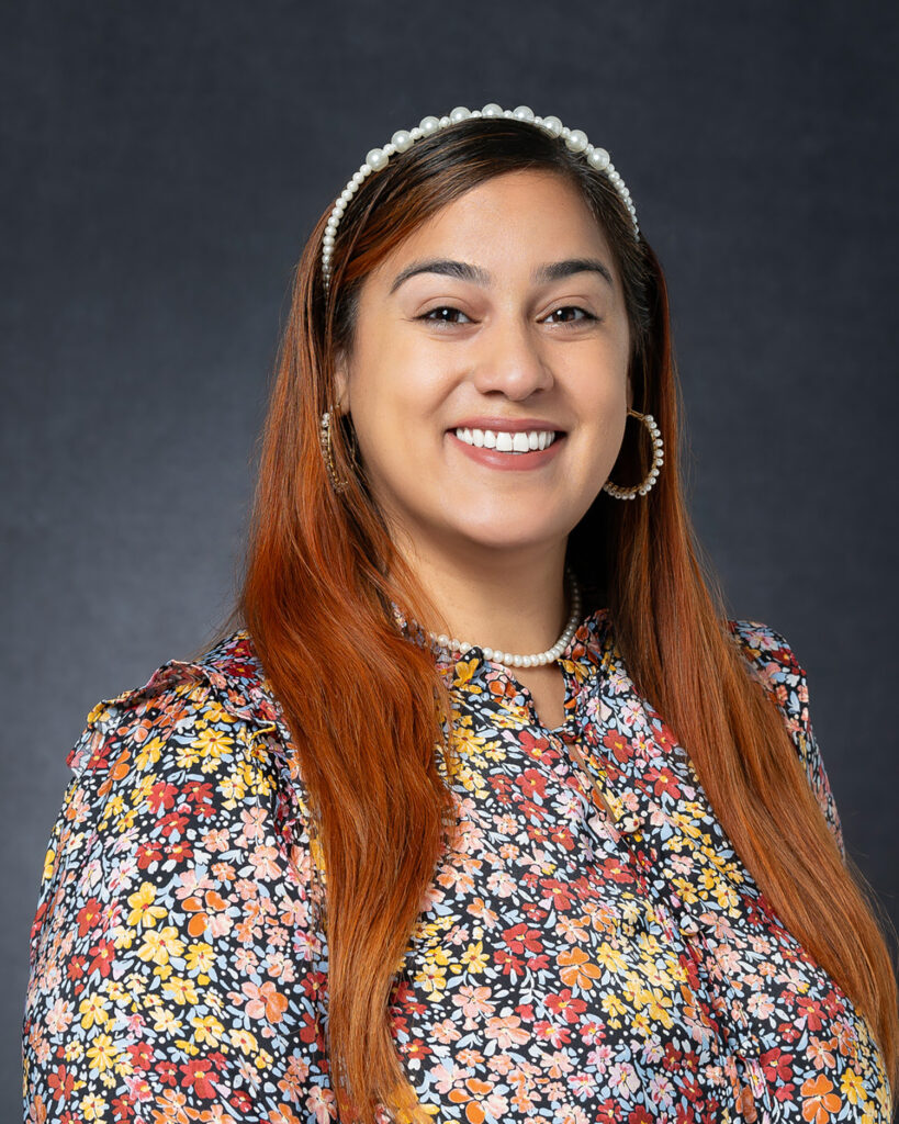 Young Woman looking at the camera lens for LinkedIn profile photos.