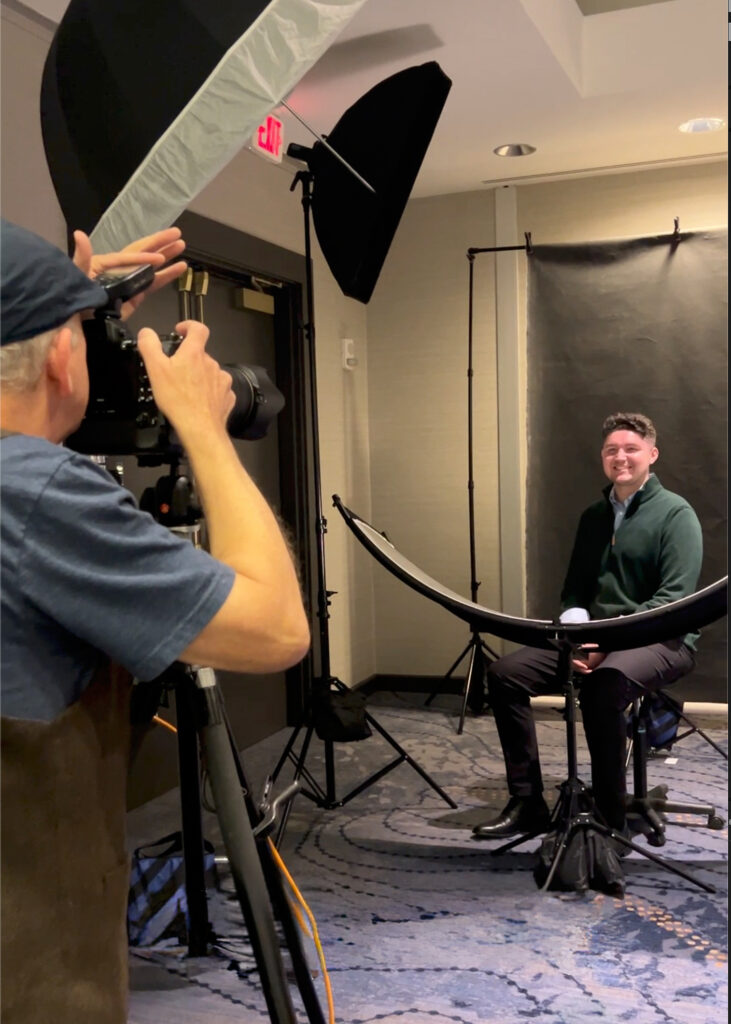 Conference headshots station set up in a hotel foyer