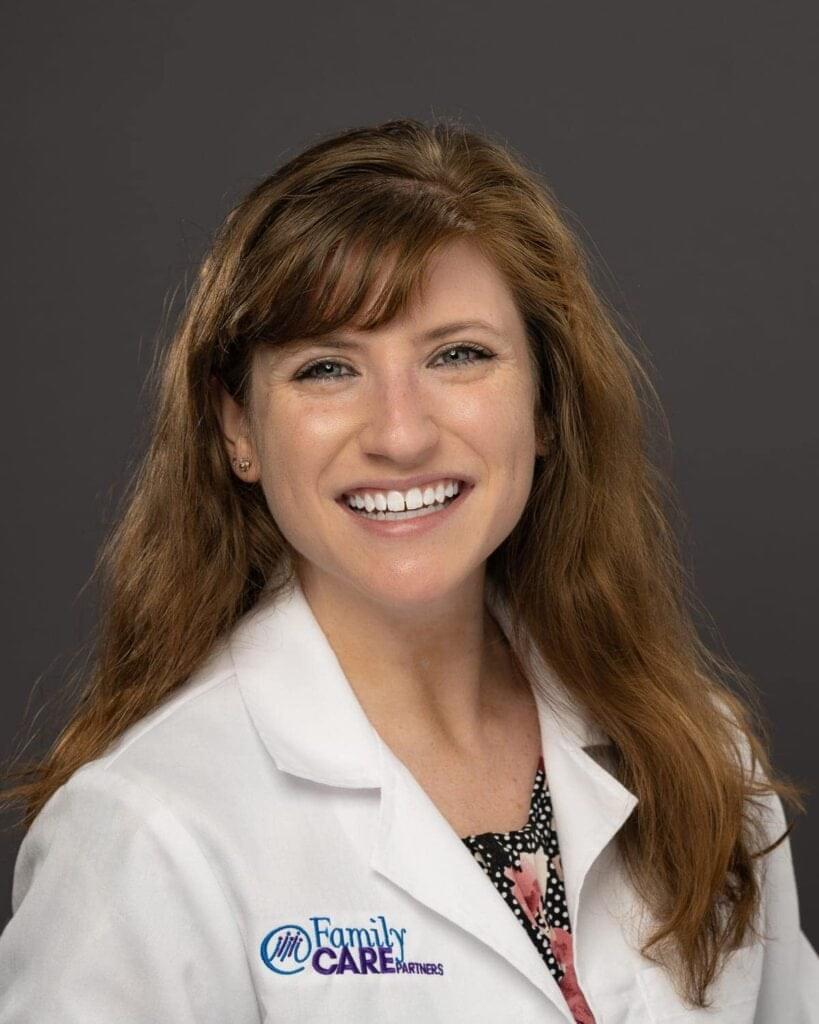 group headshot of lady smiling