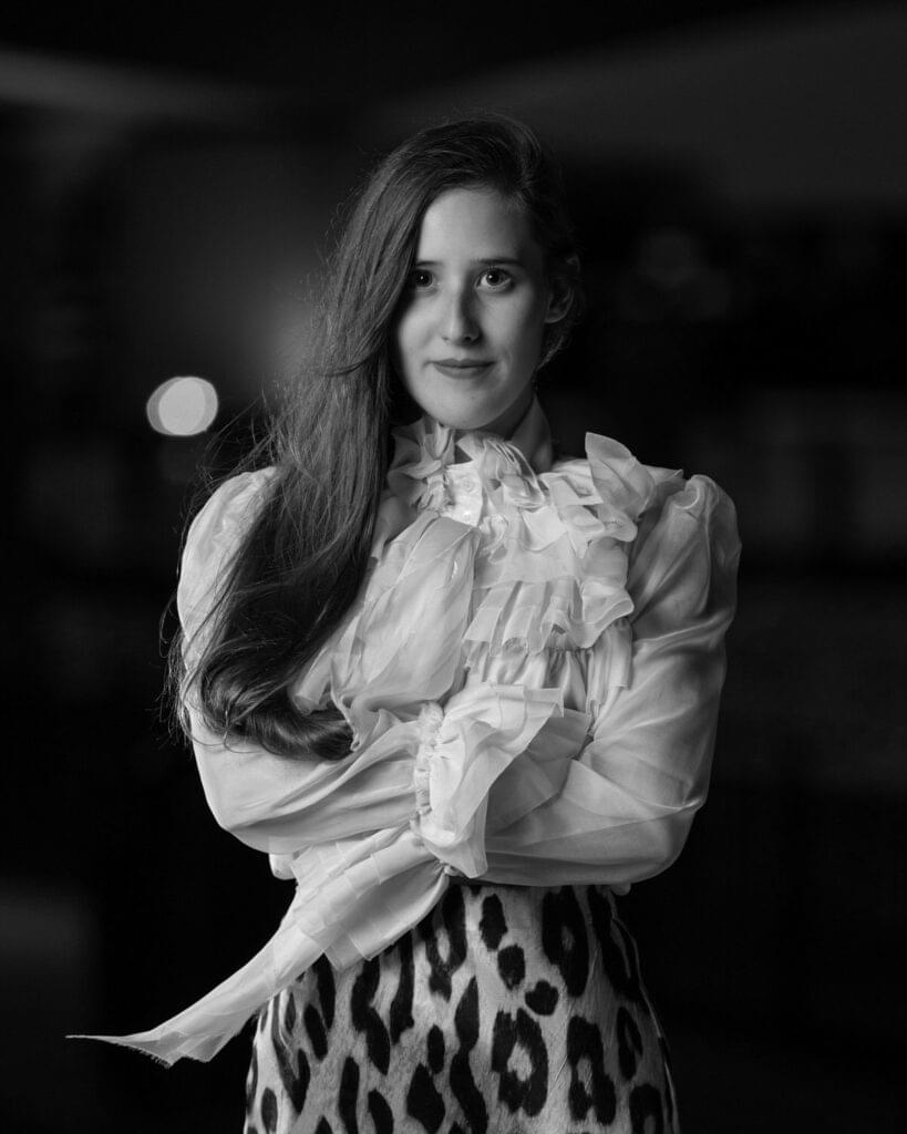 black and white night photo with flowing blouse and leopard skirt