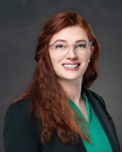Business professional looking at camera for her professional headshots